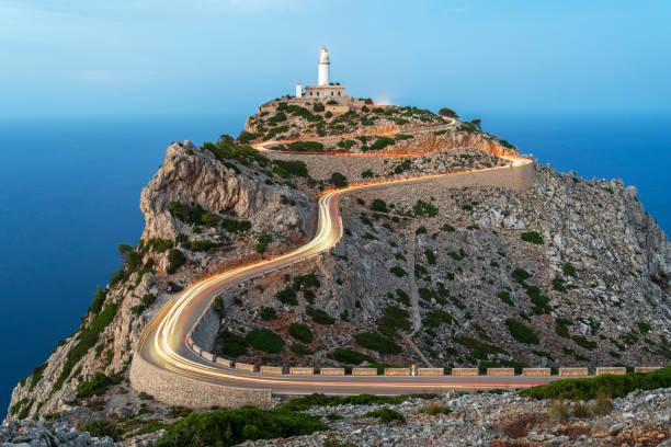Car trails lights along the road of Cap de Formentor lighthouse, Mallorca Island, Balearic Islands, Mediterranean Sea, Spain
