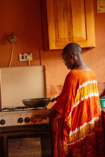 istock A young African woman doing chores in the Kitchen 2191171356
