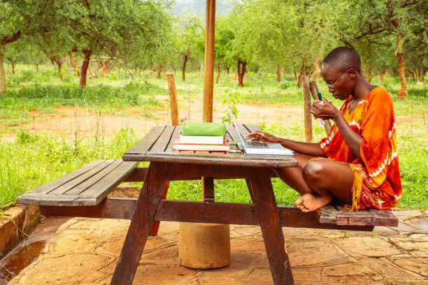 A young African woman working remotely online at home