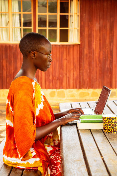 istock A young African woman sitting outside working remotely online 2191171469
