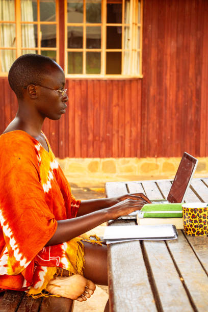 istock A young African woman sitting outside working remotely online 2191171470