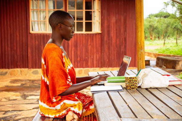 istock A young African woman sitting outside working remotely online 2191171492