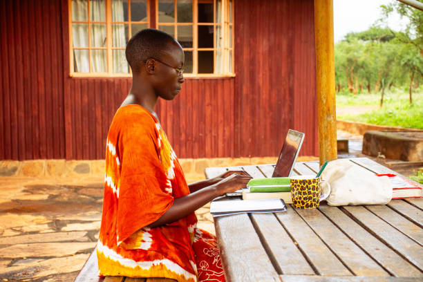 istock A young African woman sitting outside working remotely online 2191171501