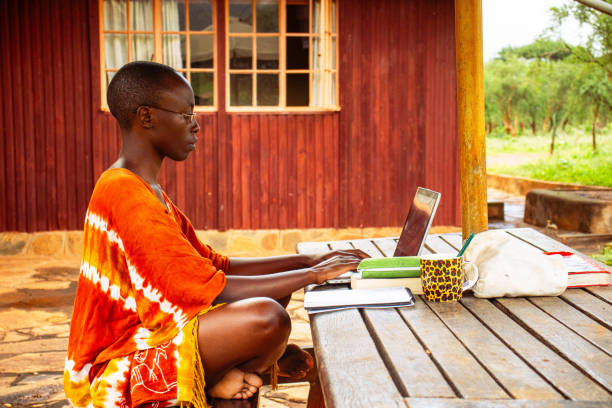 istock A young African woman sitting outside working remotely online 2191171502