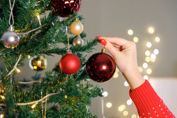 istock Close-up of a woman's hand decorating a Christmas tree 2191172918