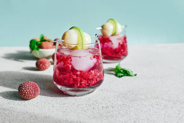istock Refreshing lychee drink with raspberry, lime, mint leaves and ice. Non-alcoholic sparkling cocktail fizzy drink perfect for summer hydration. 2191174151