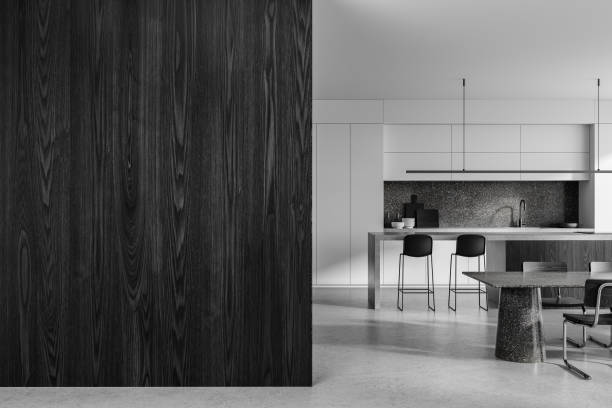 istock Modern kitchen with dark wood panel and minimalistic furniture in neutral tones. Blank wall mockup on left. 3D Rendering 2191175470