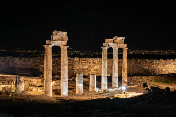 istock Night view of ancient ruins illuminated by artificial lights, showcasing architectural heritage and history. 2191175631