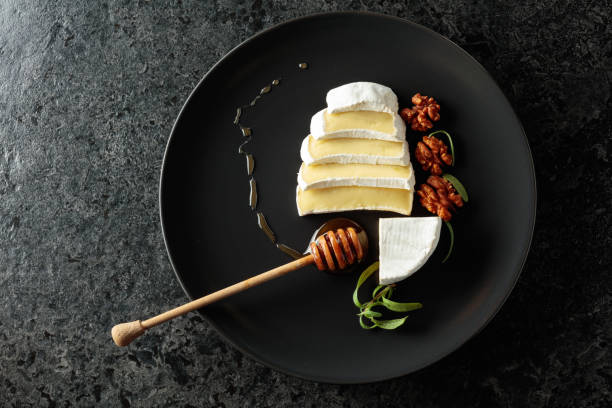istock Camembert cream cheese with honey, rosemary, and walnuts. 2191177356