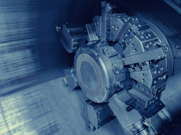 istock CNC Machine Tool in Operation. Close-up view of a high-tech CNC machine tool turret. Ideal for illustrating advanced technology in industrial and engineering contexts. 2191181445