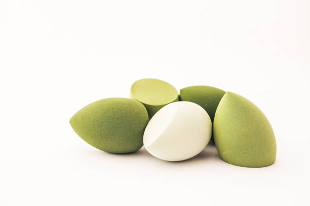 istock Green makeup sponges on a white background. A minimalist composition showcasing beauty tools for foundation blending, perfect for skincare and cosmetics themes 2191184298