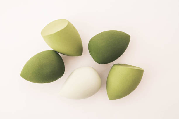 istock Green makeup sponges on a white background. A minimalist composition showcasing beauty tools for foundation blending, perfect for skincare and cosmetics themes 2191184306