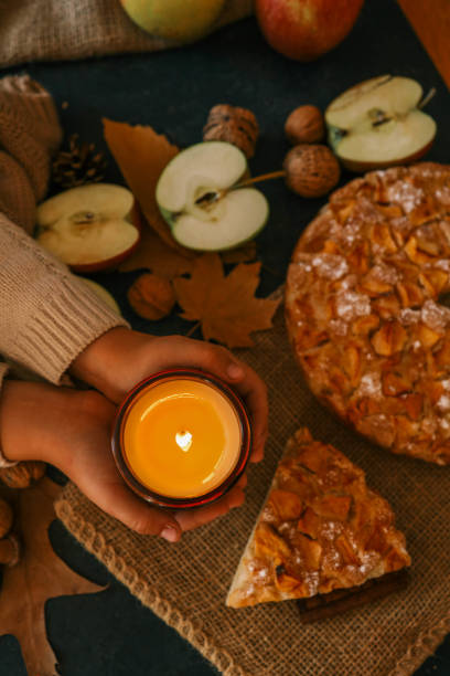 istock Candle and homemade apple pie, autumn mood 2191184533