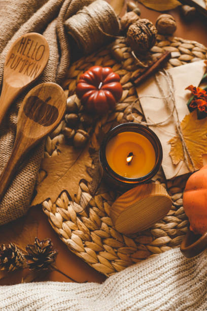istock Burning candle in a cozy warm homey autumn atmosphere 2191184882