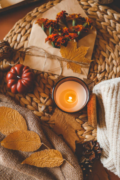 istock Burning candle in a cozy warm homey autumn atmosphere 2191184899