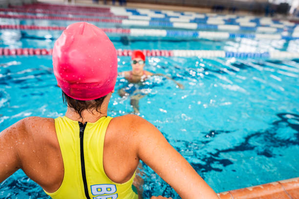 istock Girl entering the swimming pool 2191186219