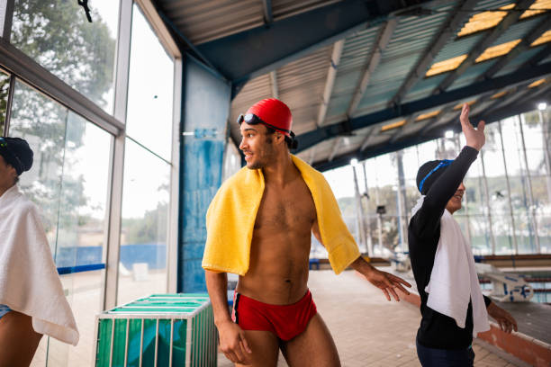 Young man arriving at the swimming pool