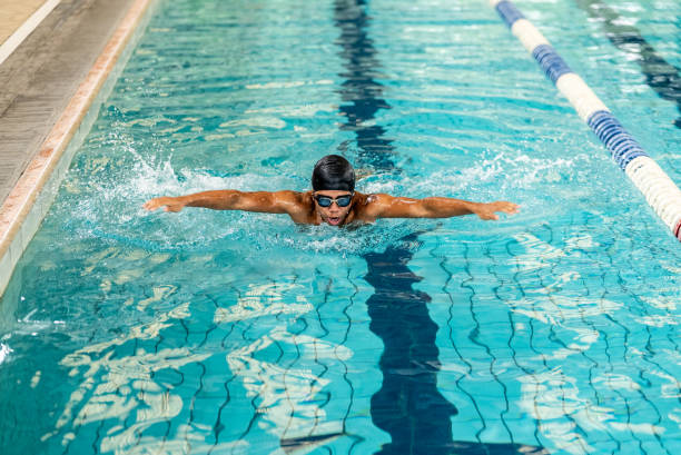 istock Young man swimming in the swimming pool 2191186272