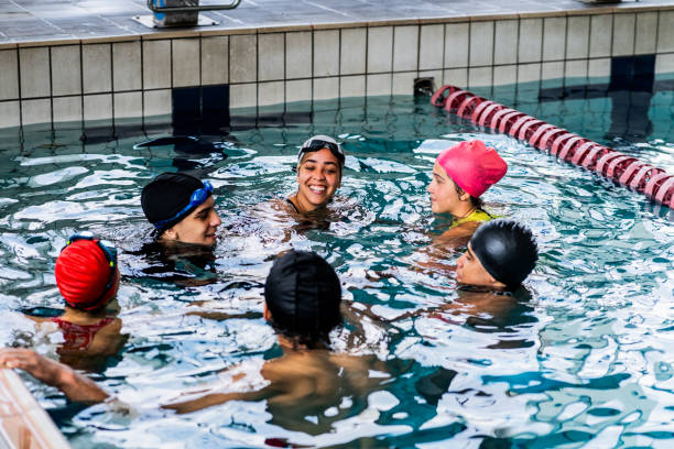 istock People talking in the swimming pool 2191186372