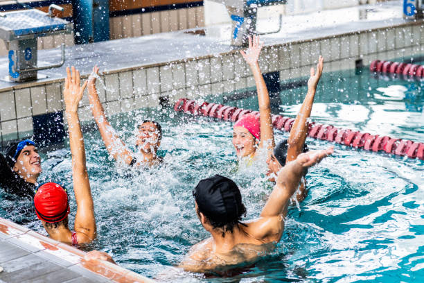 istock Friends celebrating in the swimming pool 2191186398