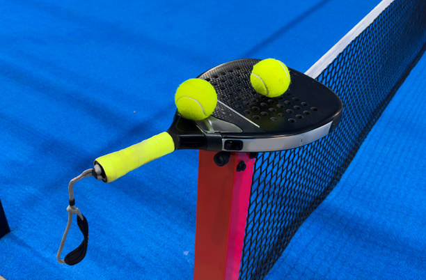 istock padel racket on a padel court with a ball 2191186829