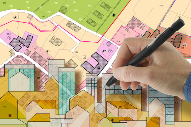 istock BUILDING PERMIT CONCEPT with imaginary cadastral map and General Urban Plan - Building activity and construction industry ideas with cityscape 2191186845
