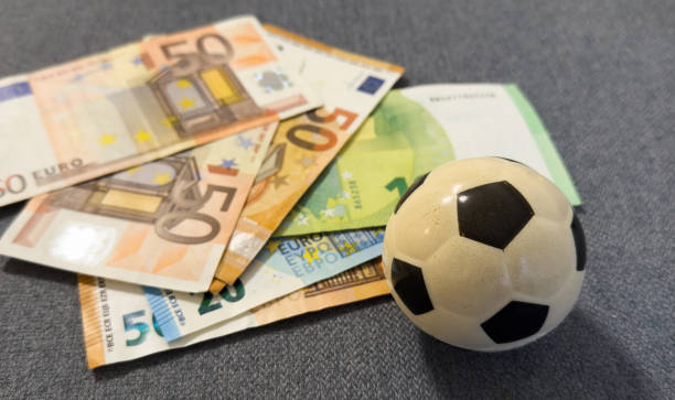 istock Soccer ball on stack of euro 2191188085