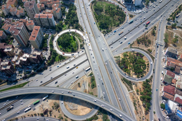 istock Trucks and cars driving on highway junctions, aerial view. 2191189861