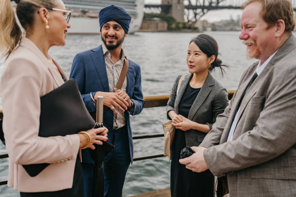 istock Business meeting by waterfront with four professionals 2191190476