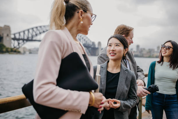 istock Business professionals networking by Sydney Harbour. 2191191218