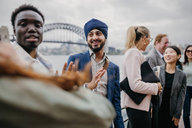 istock Close-up of joyful exchange among diverse group 2191192463