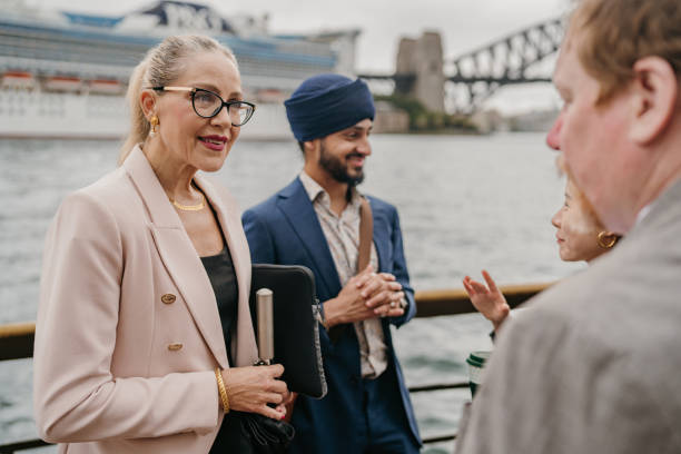 istock Colleagues interacting against iconic city bridge backdrop 2191192575