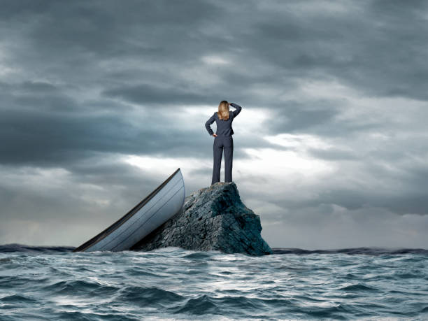 istock Woman Stranded In On Small Rock In The Ocean 2191192631