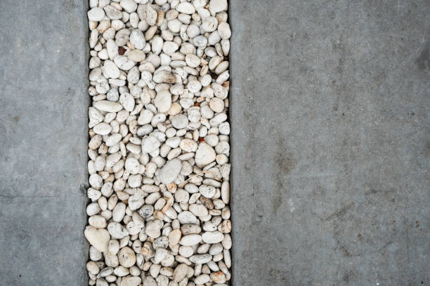 Small sea stones, gravel. Background. River pebbles, leaks of sunlight