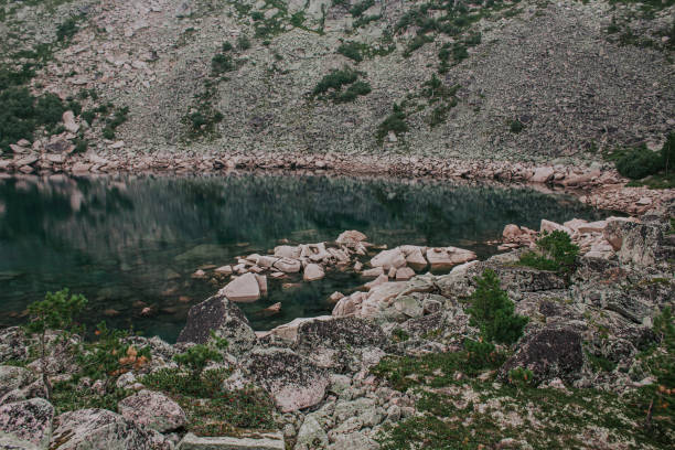 Free Stock Photo of Majestic Mountain Lake Surrounded by Rocks ...