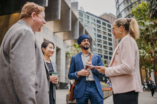 istock Engaged professionals discussing projects in city 2191193795