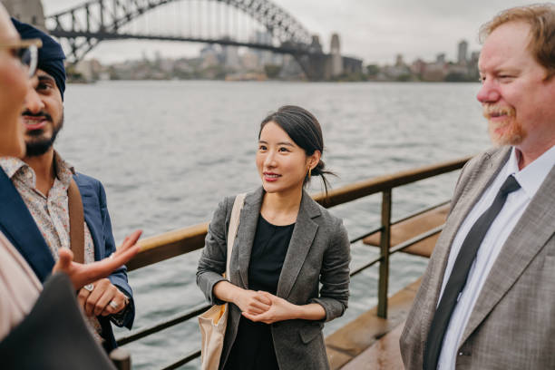 istock Four colleagues interacting by iconic Sydney backdrop 2191194590