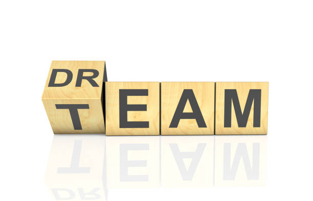 Dream team. Businessman turns cubes and changes the word dream to team.