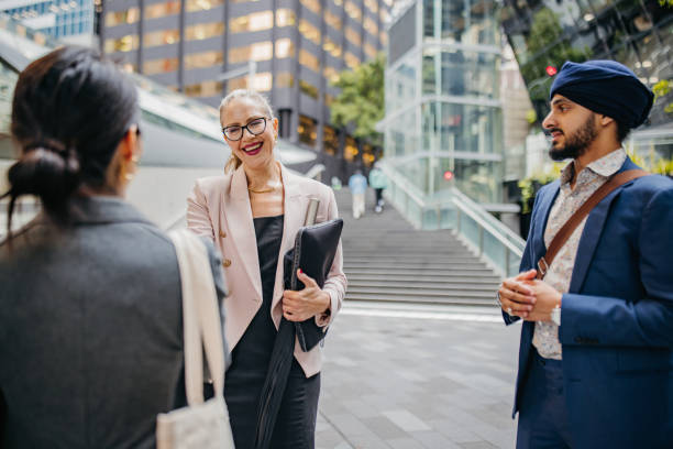 istock Professionals networking in a vibrant city setting. 2191196753