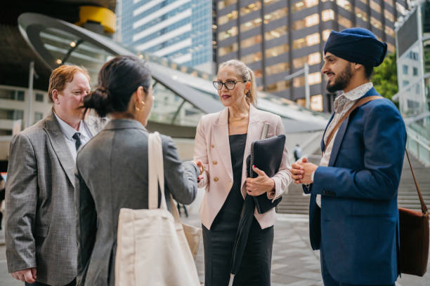 istock Team meets and greets in modern business district. 2191197030
