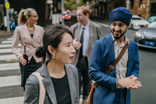 istock Urban professionals in city, engaged in conversation 2191198220