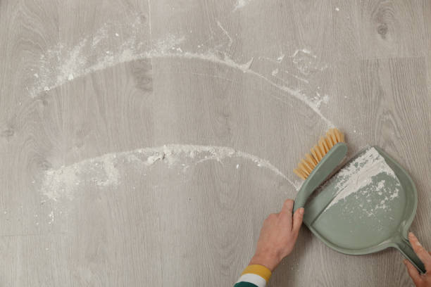 istock Woman sweeping the floor after renovation 2191198554