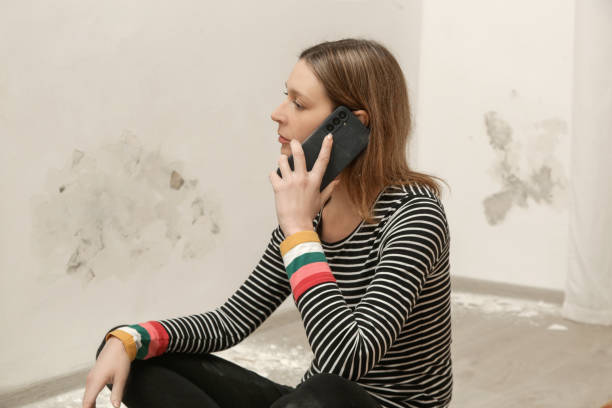 istock Stressed woman is calling for handyman. Maintenance service and home construction. 2191198601