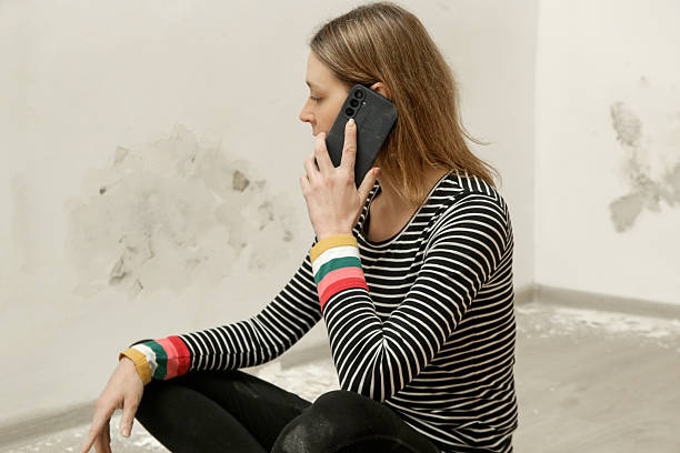 istock Stressed woman is calling for handyman. Maintenance service and home construction. 2191198634