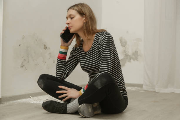 istock Stressed woman is calling for handyman. Maintenance service and home construction. 2191198795