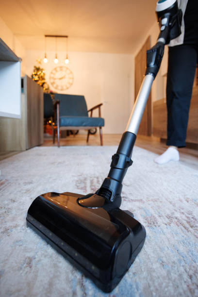 istock Vacuum Cleaning Home Carpet With Modern Cordless Sweeper 2191200158