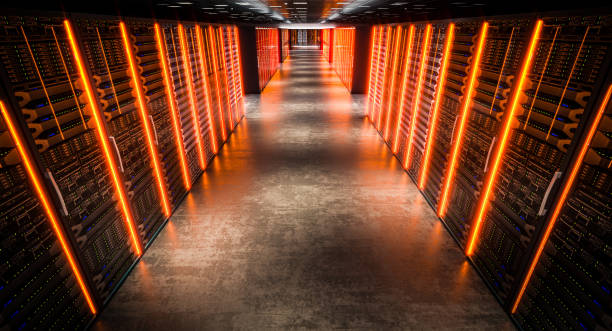 istock Server room with orange lights illuminating the corridor 2191200833