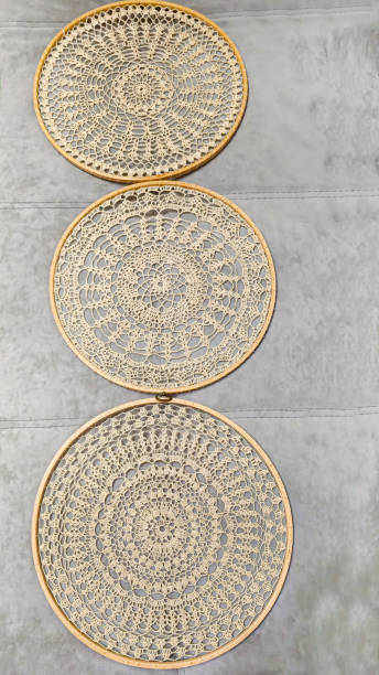 istock Crochet napkin on a wooden frame. Mandala with different patterns Decor Handmade 2191202748