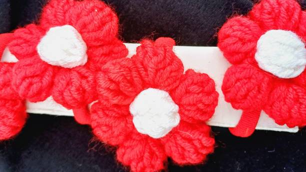 istock crocheted wool flowers. clothing accessories 2191202813