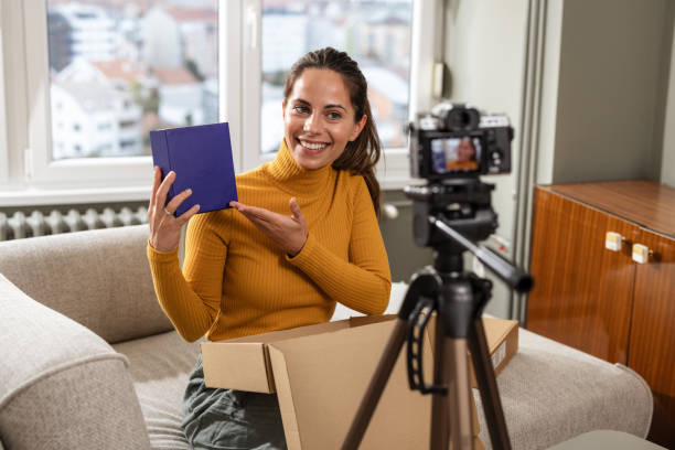 istock Excited vlogger unboxing delivery for followers 2191203047